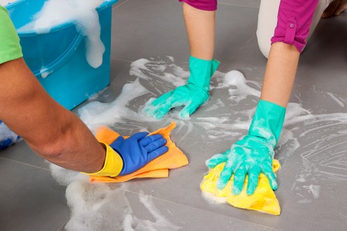 Cleaner working in a Lambeth apartment during a move-out clean