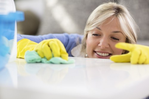 Oven cleaner using appropriate protective gear during cleaning